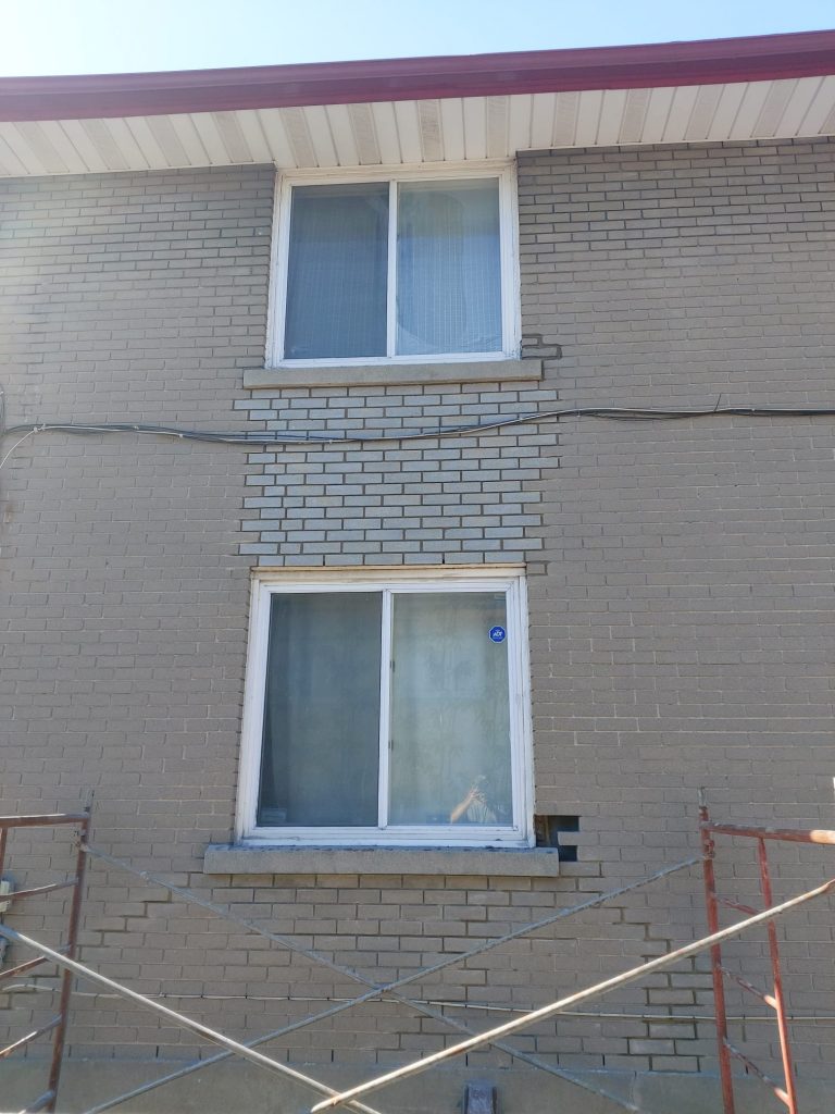 brick repointing between windows